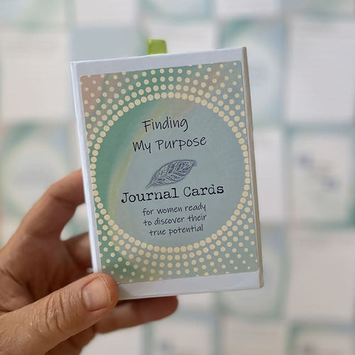 Finding My Purpose Journal Cards – self-discovery deck for women, boxed set with green ribbon pull and teal dotted design, held in hand.