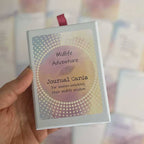 Midlife Adventure Journal Cards – deck for women unlocking their midlife wisdom, boxed set with maroon ribbon pull, held in hand.