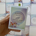 My Healing Journey Journal Cards – journal deck for women facing cancer, boxed set with green ribbon pull and butterfly design, held in hand.